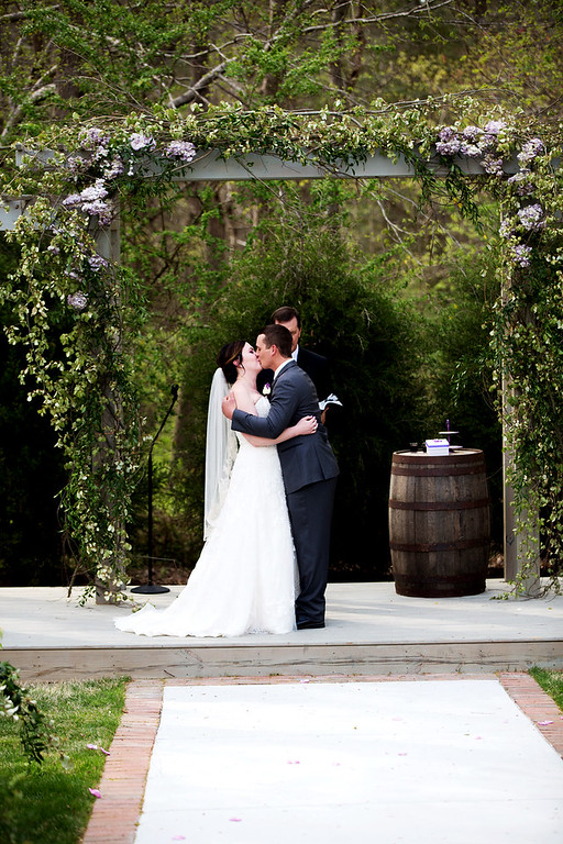 Timeless Love NC Weddings Raleigh Wedding planner shades of purple rustic elegant wedding - Ceremony- first kiss